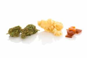 Cannabis bud, rosin, shatter. Marijuana concentrates on white background.